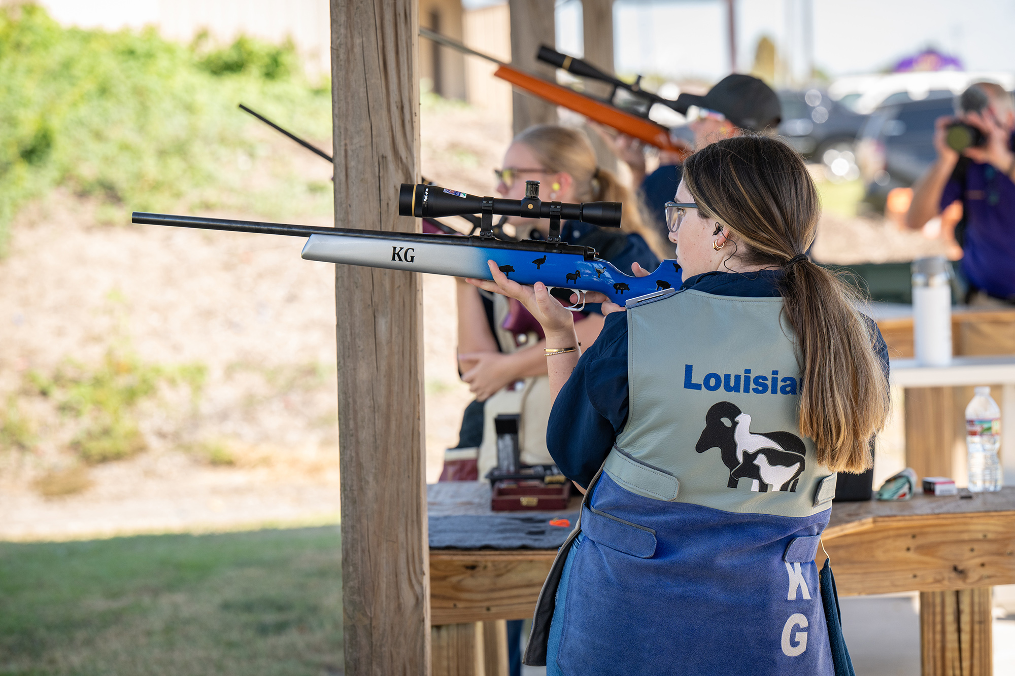 4H student prepares to fire her gun at a shooting range