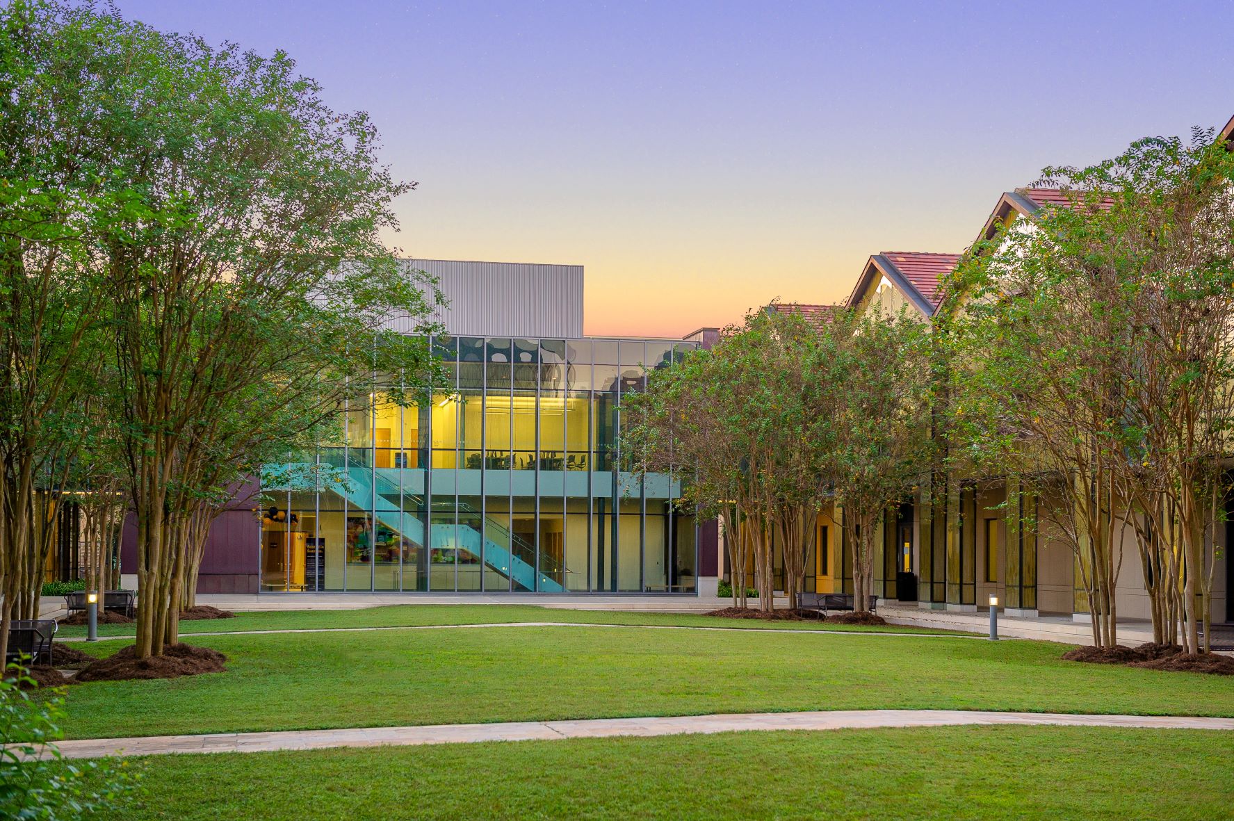 BEC Auditorium builing at dusk with purple sky