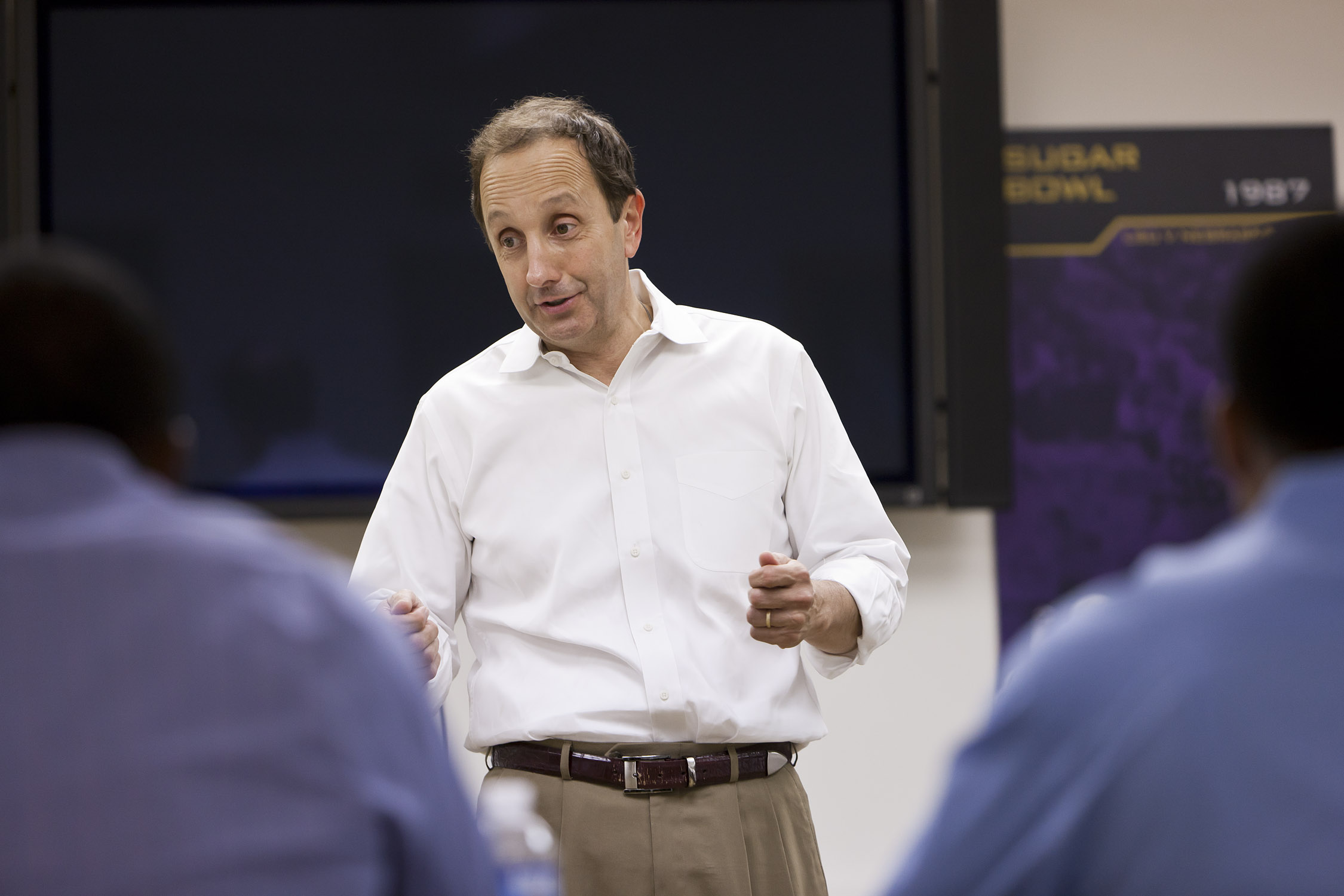 Tommy Karam lectures in front if class