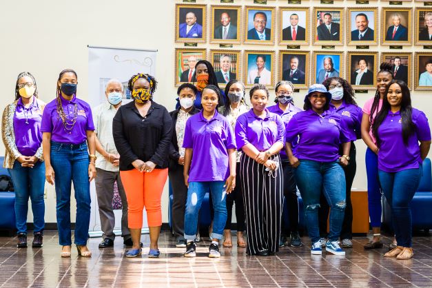 Group of students in purple shirts.