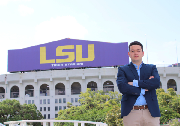 Sport Admin student posed by LSU football stadium