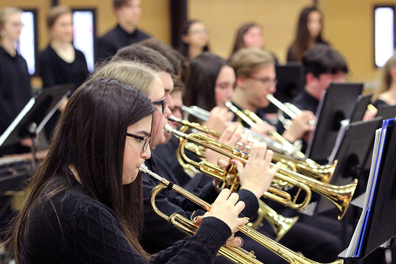 trumpet players reading music