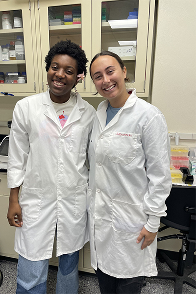 undergrad students in white lab coats